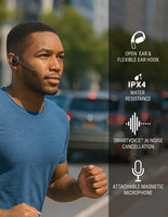 Man wearing a blue shirt with a wireless earbud, surrounded by blurred city traffic.